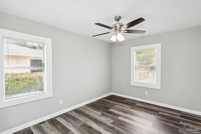 spare room featuring dark hardwood / wood-style floors and ceiling fan