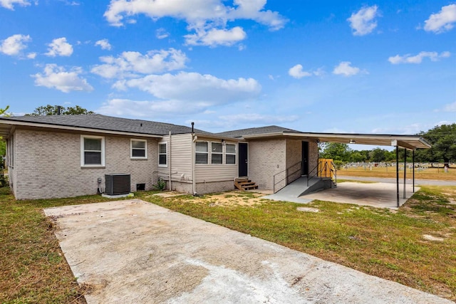 back of property featuring a yard, a patio area, and central air condition unit