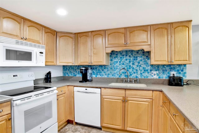 kitchen featuring white appliances, sink, light brown cabinets, and tasteful backsplash