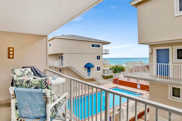 balcony featuring a water view