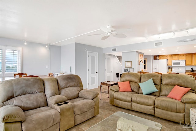 living room with rail lighting, ceiling fan, and light tile patterned flooring