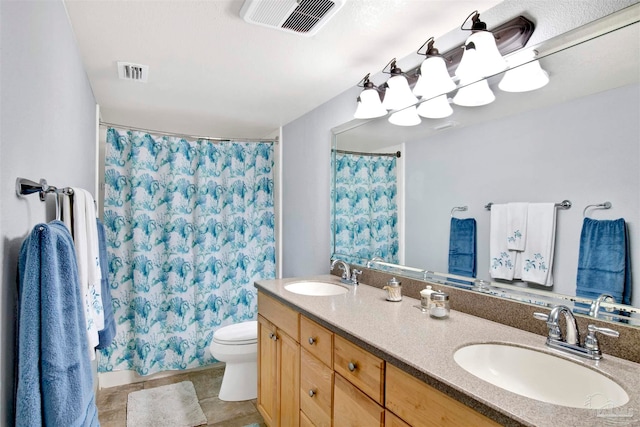 bathroom with tile patterned flooring, vanity, toilet, and a shower with shower curtain