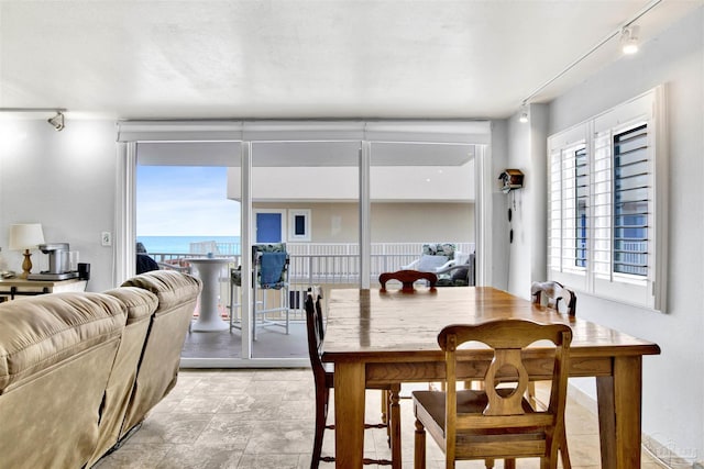 1111 Ft Pickens Rd Unit 524, Pensacola Beach, FL 32561 - dining room with rail lighting and a water view