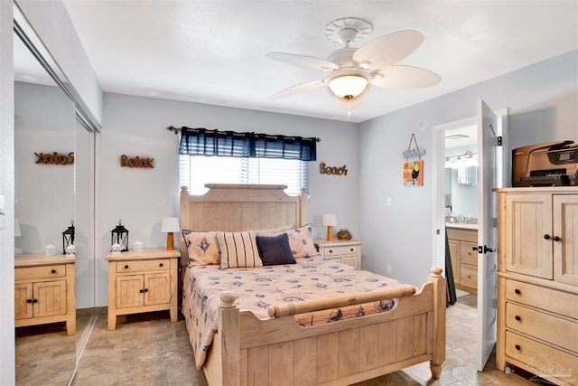 bedroom featuring a closet, ceiling fan, connected bathroom, and sink