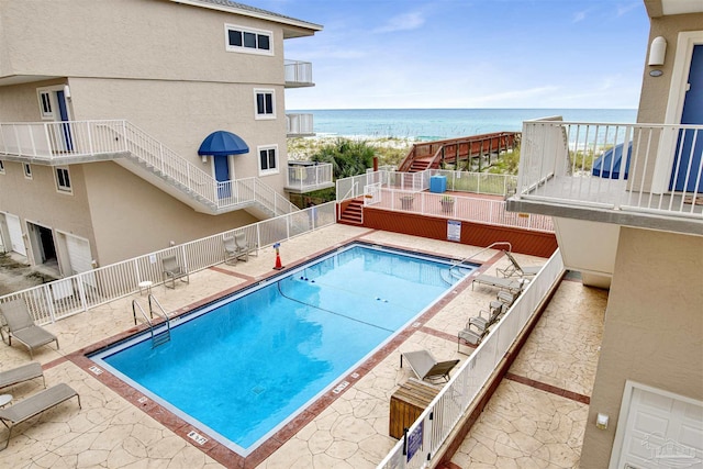 1111 Ft Pickens Rd Unit 524, Pensacola Beach, FL 32561 - community pool with a water view, stairway, and fence