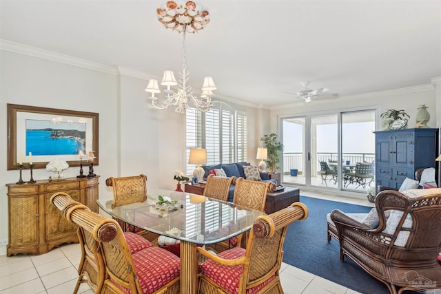 dining area featuring crown molding, ceiling fan with notable chandelier, and light tile patterned floors