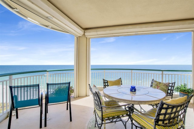 balcony featuring a water view