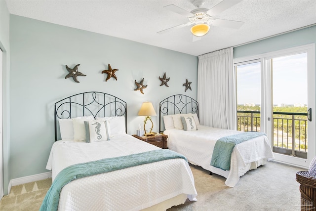 carpeted bedroom featuring ceiling fan, a textured ceiling, and access to outside