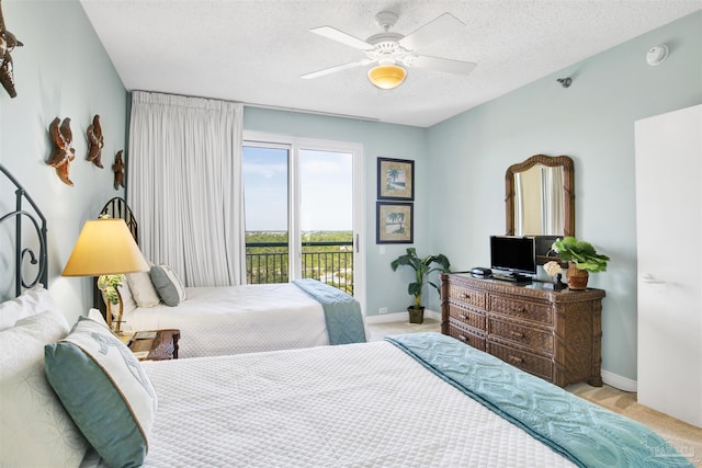 bedroom featuring light carpet, a textured ceiling, access to outside, and ceiling fan