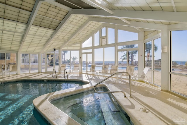 view of swimming pool featuring an indoor hot tub