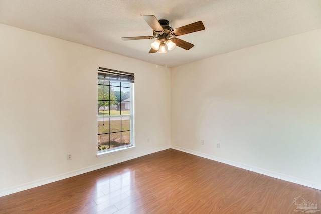 3086 Myrshine Dr, Pensacola, FL 32506 - spare room featuring ceiling fan, baseboards, wood finished floors, and a textured ceiling