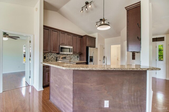 3086 Myrshine Dr, Pensacola, FL 32506 - kitchen featuring light stone counters, stainless steel appliances, dark brown cabinets, wood finished floors, and a sink