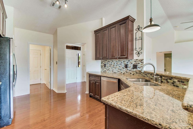 3086 Myrshine Dr, Pensacola, FL 32506 - kitchen with lofted ceiling, appliances with stainless steel finishes, a sink, and a textured ceiling