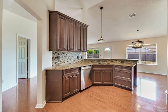 3086 Myrshine Dr, Pensacola, FL 32506 - kitchen featuring stainless steel dishwasher, a sink, light stone countertops, decorative backsplash, and light wood-style flooring