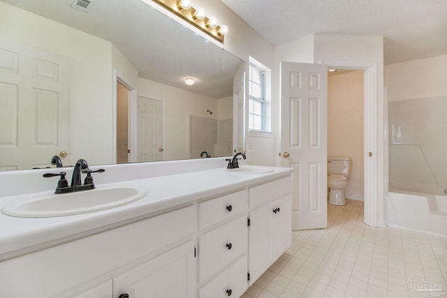 3086 Myrshine Dr, Pensacola, FL 32506 - bathroom featuring toilet, tile patterned flooring, a sink, and double vanity