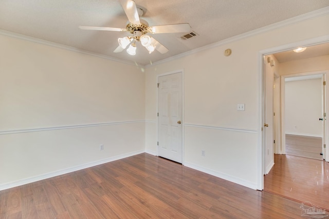 3086 Myrshine Dr, Pensacola, FL 32506 - empty room featuring wood finished floors, visible vents, crown molding, baseboards, and ceiling fan
