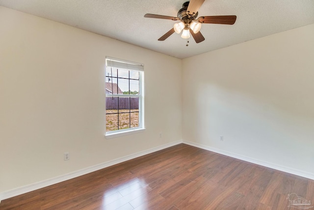 3086 Myrshine Dr, Pensacola, FL 32506 - unfurnished room featuring a ceiling fan, baseboards, a textured ceiling, and dark wood-style flooring