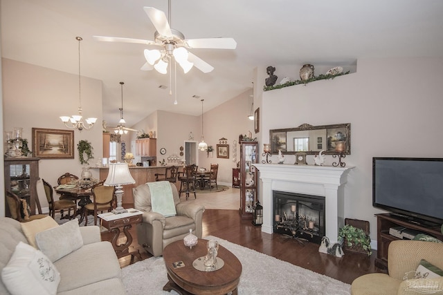 1013 Patriot Pl, Pensacola, FL 32534 - living room featuring high vaulted ceiling, dark hardwood / wood-style floors, and ceiling fan with notable chandelier