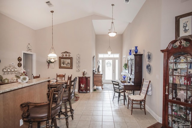1013 Patriot Pl, Pensacola, FL 32534 - dining area featuring high vaulted ceiling and light tile patterned floors
