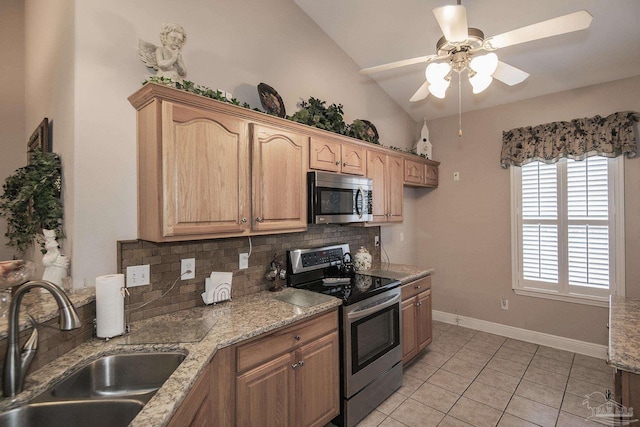 1013 Patriot Pl, Pensacola, FL 32534 - kitchen featuring sink, vaulted ceiling, appliances with stainless steel finishes, light stone countertops, and backsplash