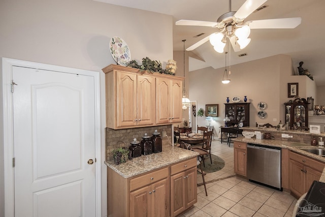 1013 Patriot Pl, Pensacola, FL 32534 - kitchen featuring tasteful backsplash, light stone countertops, light tile patterned flooring, vaulted ceiling, and stainless steel dishwasher