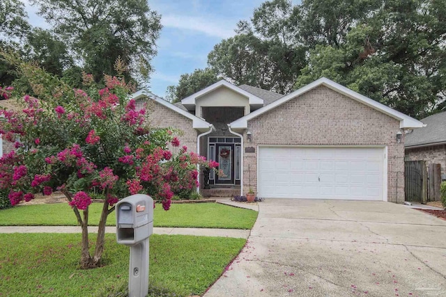 1013 Patriot Pl, Pensacola, FL 32534 - view of front of house with a garage and a front lawn