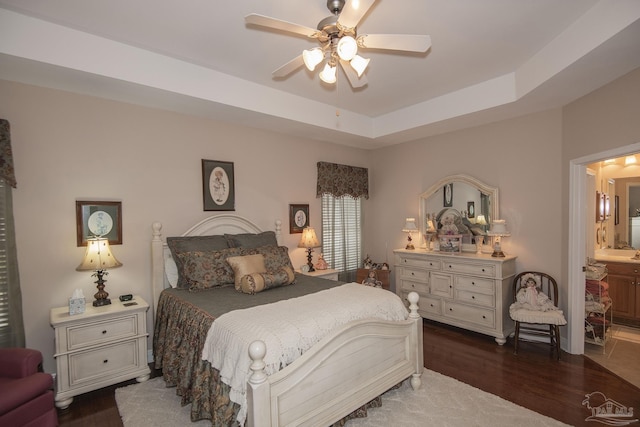 1013 Patriot Pl, Pensacola, FL 32534 - bedroom featuring a raised ceiling, ceiling fan, dark hardwood / wood-style floors, and ensuite bath
