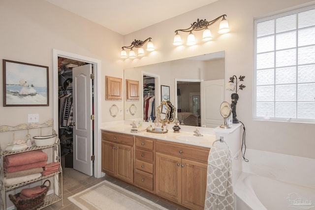 1013 Patriot Pl, Pensacola, FL 32534 - bathroom with tile patterned floors, vanity, and a tub