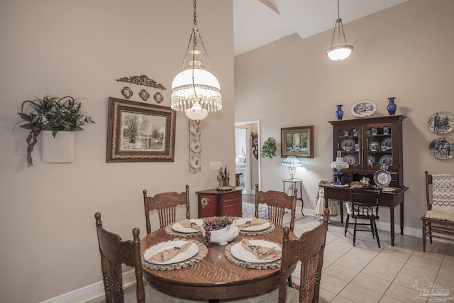 1013 Patriot Pl, Pensacola, FL 32534 - dining room featuring an inviting chandelier, light tile patterned floors, and a towering ceiling