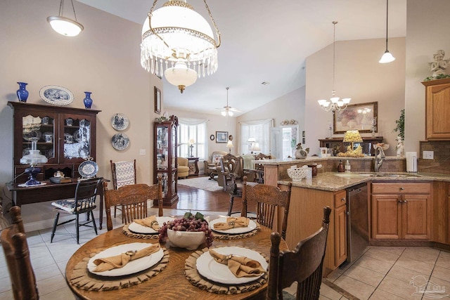 1013 Patriot Pl, Pensacola, FL 32534 - tiled dining area featuring sink, ceiling fan with notable chandelier, and high vaulted ceiling