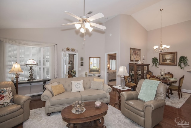 1013 Patriot Pl, Pensacola, FL 32534 - living room featuring ceiling fan with notable chandelier, hardwood / wood-style floors, and high vaulted ceiling