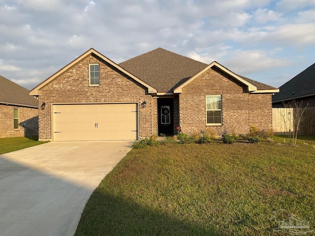 view of front facade with a garage and a front yard