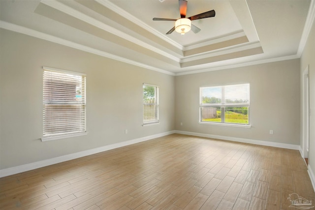 2665 Tulip Hill Rd, Pace, FL 32571 - unfurnished room with a raised ceiling, light wood finished floors, ornamental molding, ceiling fan, and baseboards