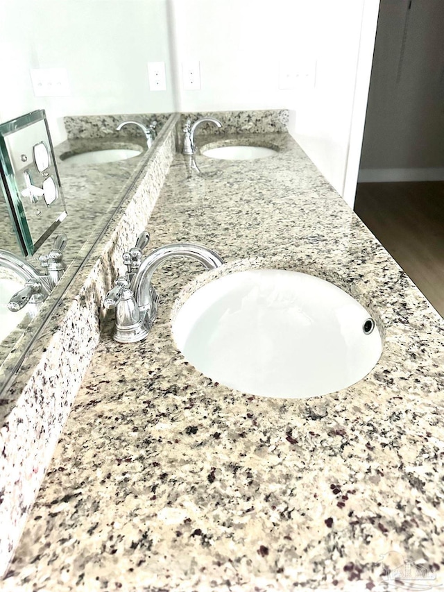 2665 Tulip Hill Rd, Pace, FL 32571 - bathroom view of double vanity and wood finished floors