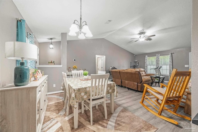 6856 Old W Ln, Milton, FL 32570 - dining area featuring ceiling fan, a chandelier, light wood finished floors, vaulted ceiling, and baseboards