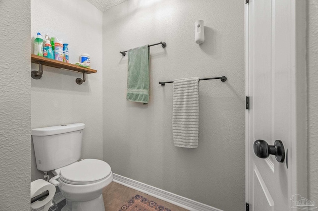 6856 Old W Ln, Milton, FL 32570 - bathroom featuring toilet, wood finished floors, and baseboards