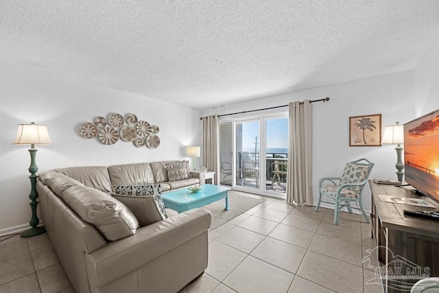 tiled living room with a textured ceiling