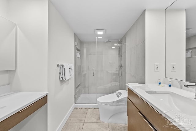 bathroom featuring vanity, toilet, and a shower with door