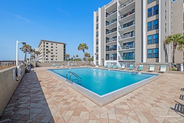 view of swimming pool featuring a patio area