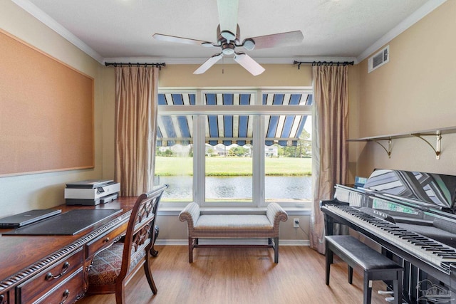 1124 Willowood Cir, Gulf Breeze, FL 32563 - office area featuring ornamental molding, visible vents, ceiling fan, a water view, and light wood finished floors