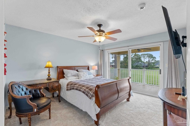 1124 Willowood Cir, Gulf Breeze, FL 32563 - carpeted bedroom with access to outside, a textured ceiling, and ceiling fan