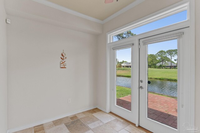 1124 Willowood Cir, Gulf Breeze, FL 32563 - doorway to outside featuring a water view, stone tile flooring, baseboards, and crown molding