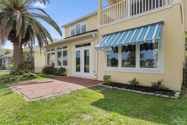 1124 Willowood Cir, Gulf Breeze, FL 32563 - rear view of property with a patio, stucco siding, french doors, a yard, and fence