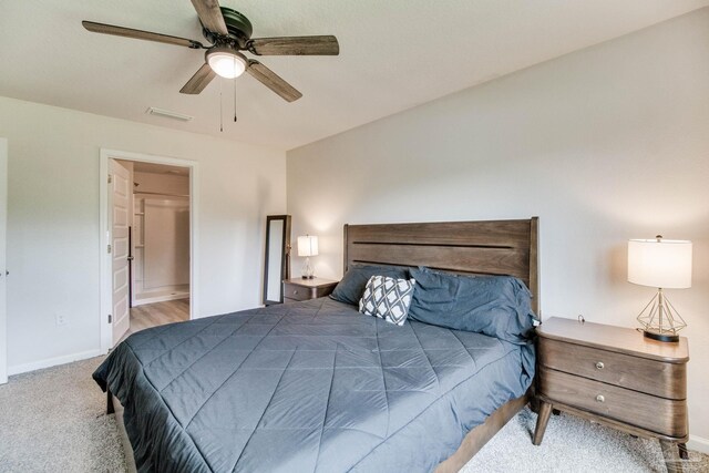 10885 Blacktail Loop, Pensacola, FL 32526 - carpeted bedroom featuring baseboards, connected bathroom, and a ceiling fan