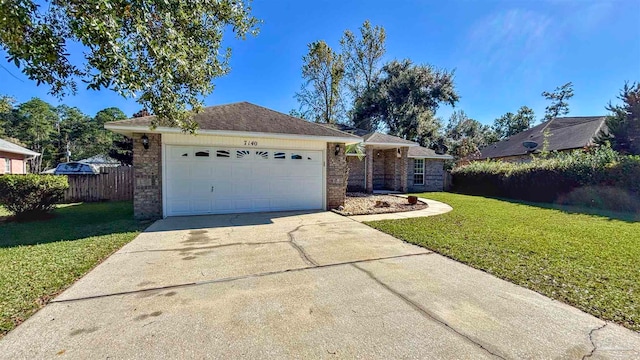 ranch-style home with a front yard and a garage