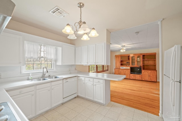 3570 Firestone Blvd, Pensacola, FL 32503 - kitchen with white appliances, visible vents, white cabinets, and a sink