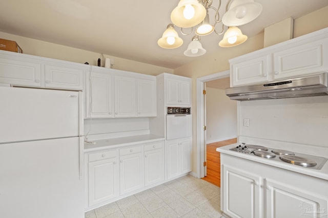 3570 Firestone Blvd, Pensacola, FL 32503 - kitchen featuring light countertops, a chandelier, under cabinet range hood, white appliances, and white cabinets
