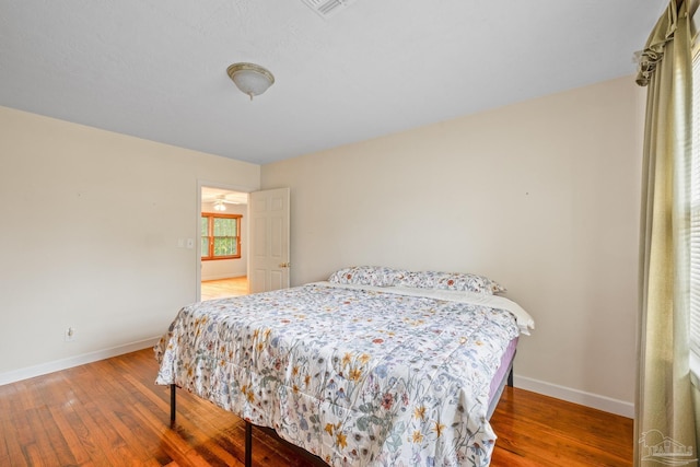3570 Firestone Blvd, Pensacola, FL 32503 - bedroom featuring wood-type flooring, baseboards, and visible vents