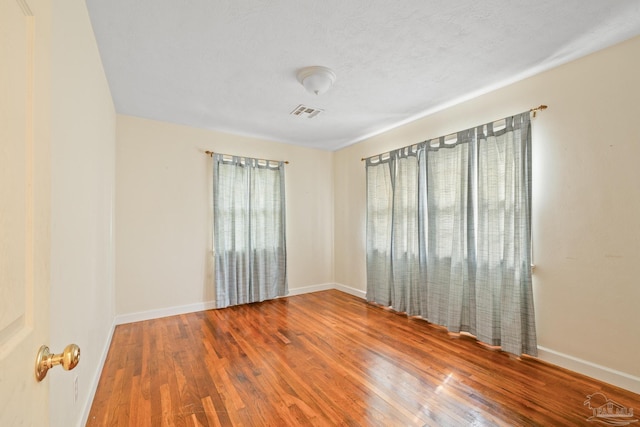 3570 Firestone Blvd, Pensacola, FL 32503 - spare room with visible vents, baseboards, and wood finished floors