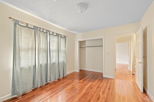 3570 Firestone Blvd, Pensacola, FL 32503 - unfurnished bedroom with a closet, baseboards, and wood finished floors
